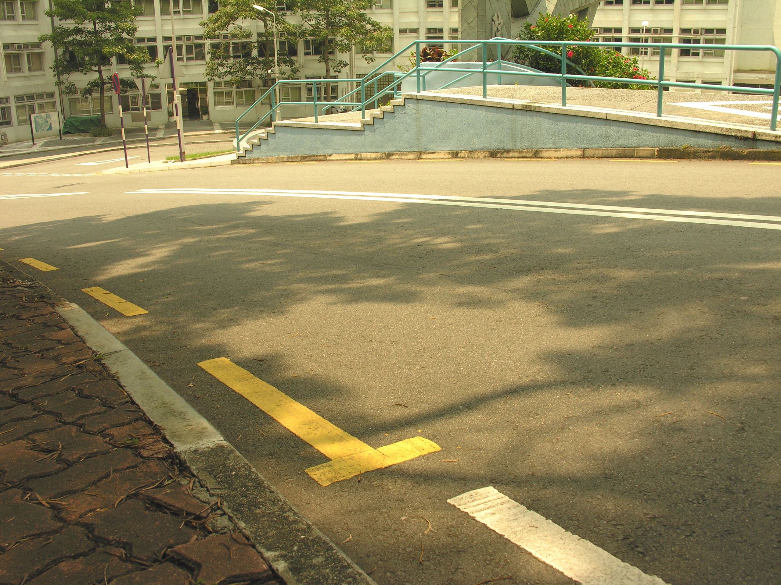 Painted street curb with red fire lane markings